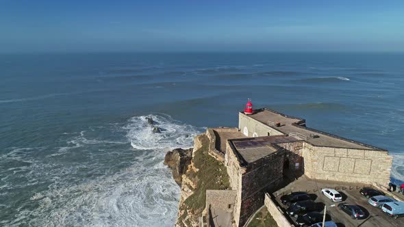 Lighthouse on a Cliff with a Fortress in Nazare alt