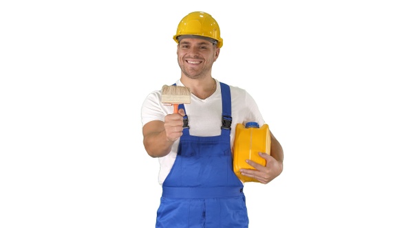Worker holding paint brush smiling to camera on white background alt