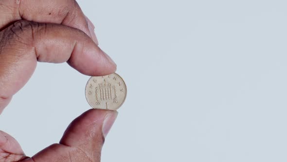 Hand Holding 1 Penny Back  alt