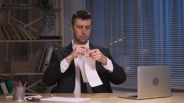Businessman Ripping Contract Into Small Apart and Throws Into Air alt