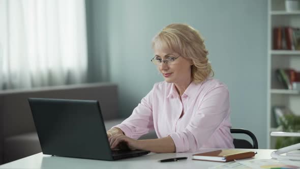 Mature Female Writer Inspired Working on New Series of Adventure Books alt