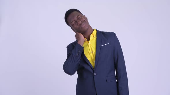Young Stressed African Businessman Having Neck Pain alt