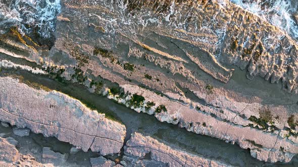 Texture of the rocky beach aerial view 4 K Turkey Alanya alt