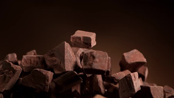 Super Slow Motion Shot of Raw Chocolate Chunks After Being Exploded at 1000Fps alt