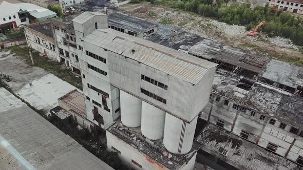 Abandoned industrial building. Ruins of an old factory. Aerial view alt