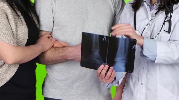 Doctor Explains the X-ray Picture and Says Goodbye To Patient alt