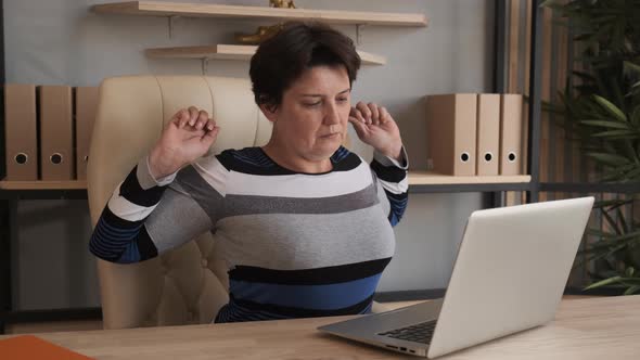 Woman Is Tired of Sitting at the Computer and Working.  alt