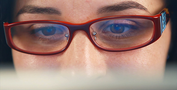 Businesswoman Working on Device - Closeup 1  alt