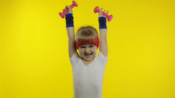 Caucasian Girl in Sportswear Making Exercises with Dumbbells, Workout for Kids, Athletic Child alt