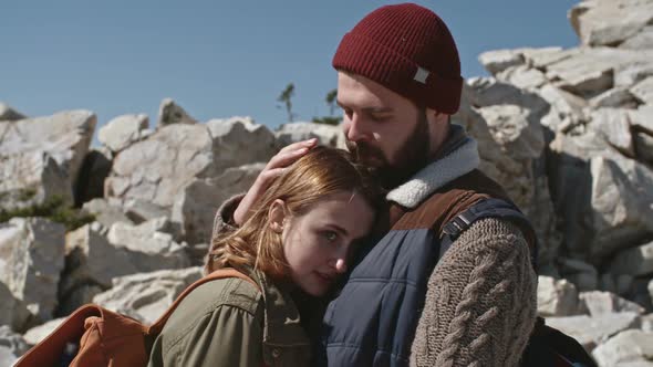 Affectionate Couple on Hike alt