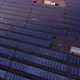 Aerial Shot of a Huge Solar Power Plant in a Big Field. Electricity Generation From Solar Energy
