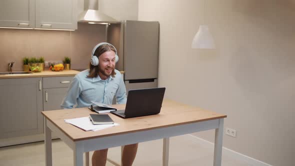 Handheld Remote Work Male Manager is Late for an Online Meeting on a Video Conference a Funny Image alt