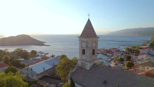 Aerial View of the Old European Church in the Town on the Sea Shore on Sunset