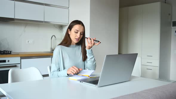 Young Woman is Sending Audio Voice Message By Her Smartphone alt