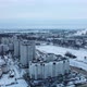 Flying in a suburban park. City blocks are visible. Winter cityscape. - VideoHive Item for Sale