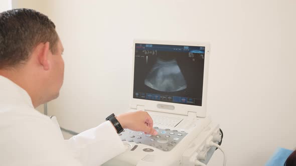 Pregnant Woman Getting Ultrasound Check By Gynecologist alt