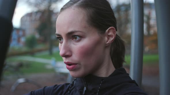 Beautiful Woman Using Gym Chest Press Equipment alt