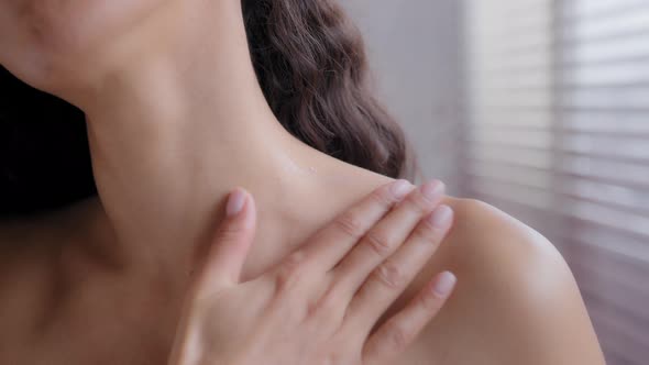Closeup Beautiful Unrecognizable Nude Sensual Young Woman Treating Neck and Shoulder with alt