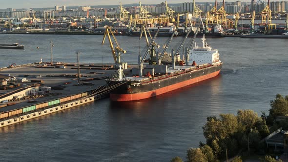 Aerial Vie of Cargo Ship Unloading in the Port alt