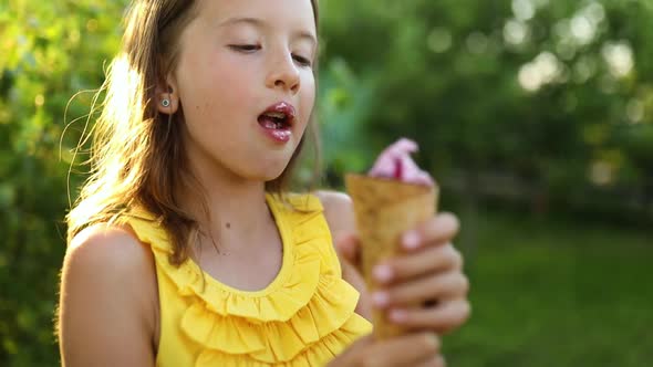 Cute girl with braces eating italian ice cream cone