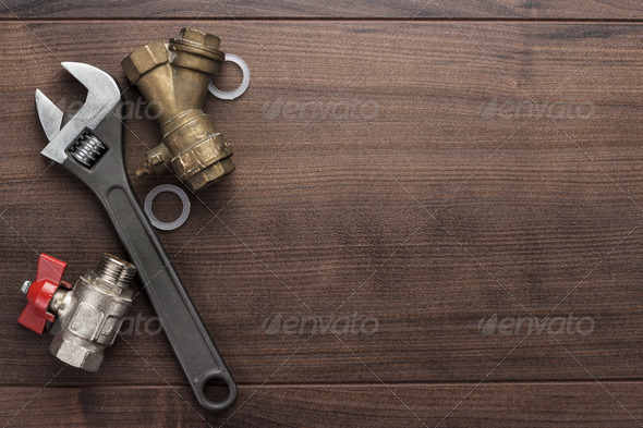 Adjustable Wrench And Pipes - Stock Photo - Images
