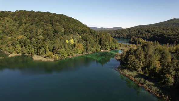 Flying over the famous Plitvice Lakes with forest at summer in Croatia, Europe alt