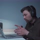 A Male Software Developer Makes a Videocall with Coworkers While Sitting at His Computer and Using p - VideoHive Item for Sale