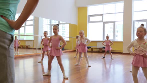 Group of little girls practicing in ballet school