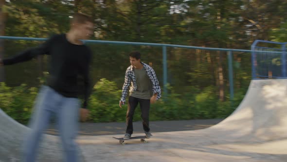 Slowmo of Guys Skating on Ramp alt