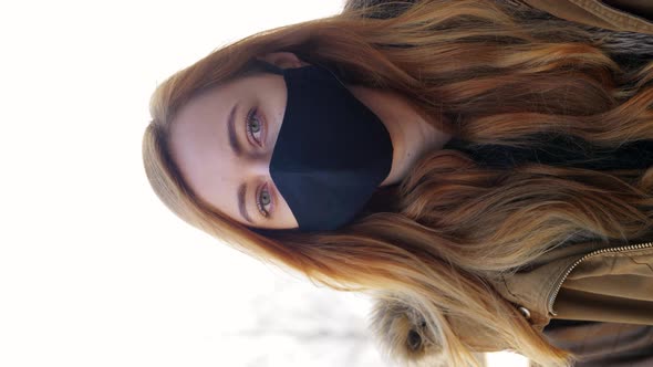 Woman Wearing Protective Reusable Barrier Mask alt