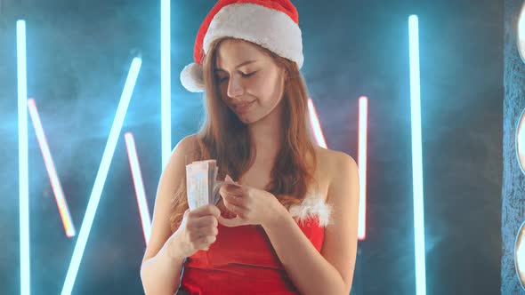 Christmas Holiday Sale Concept Woman Dressed in Santa Costume Santa Hat Holding Money in Hand While
