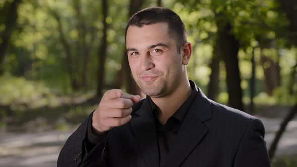 Handsome Caucasian Arabian Sexy Seductive Businessman in Formal Black Suit Standing Outdoors alt