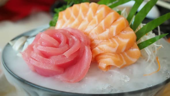 Japanese sashimi set (salmon, tuna) with dry ice smoke.