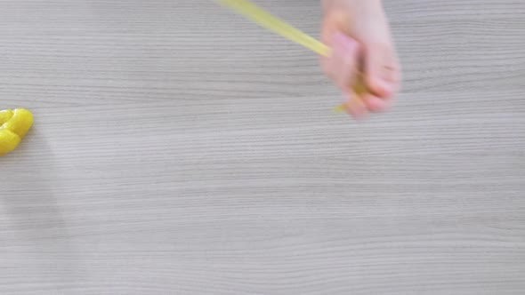 Hand Playing with Textured Slime with Bubbles Stretching the Gooey Substance alt