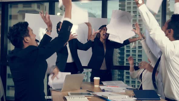 Successful Asian Business People Celebrate Project Success in Group Meeting alt