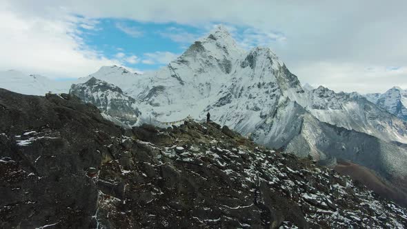Hiker Man and Ama Dablam Mountain. Himalaya, Nepal. Aerial View alt
