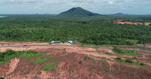 4K Cinematic aerial view of bauxite land with Mountain