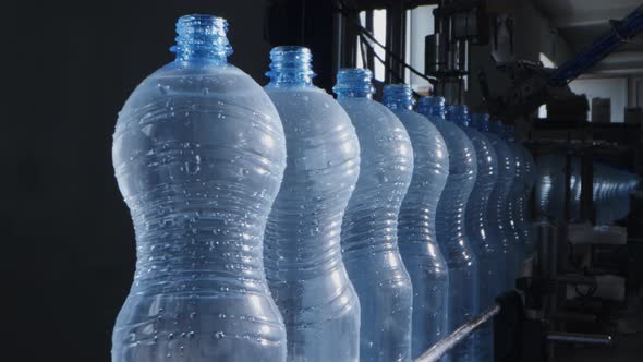 Water Factory Bottling Pure Spring Water Into Bottles on Automatic Conveyor Line