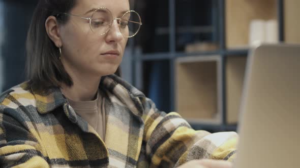 Content Woman Relaxing With Laptop At Home alt