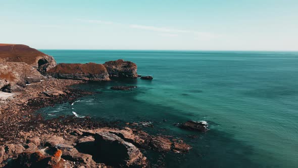 Seascape of the Atlantic Ocean bay with rocks above the water. Aerial view.