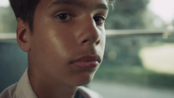 Portrait Indian School Boy Looking Camera in Vehicle alt