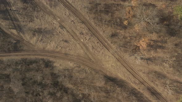 Above the mud road crossing 4K drone video alt