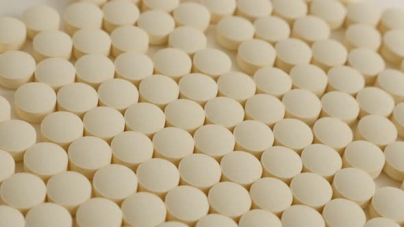 Medicaments arranged  slow tilting over on white surface 4K 3840X2160 UHD video - Health care tablet alt