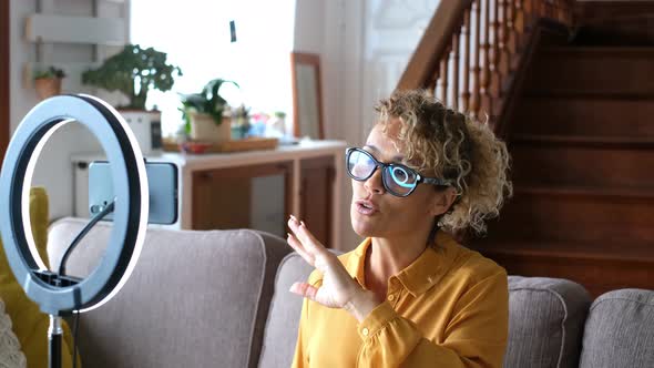 Online class lesson from home - footage content creator record with phone and light alt