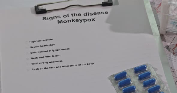 Medical Table with Test Tube Blood for Monkeypox Virus Phonendoscope Mask and Gloves alt