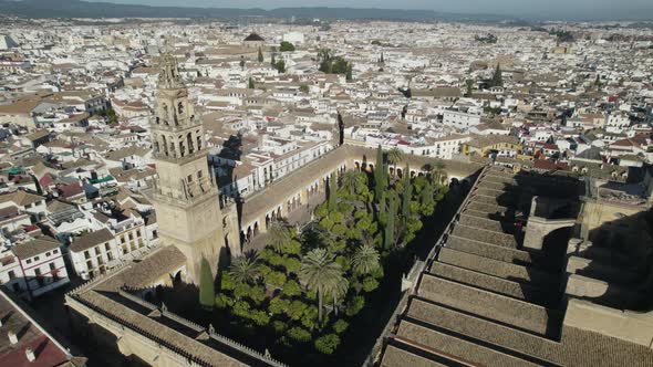 Orbiting view of Mosque-Cathedral of Cordoba and Iconic garden, Patio de los naranjos. Spain