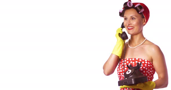 Cheerful Housewife In pin Up Style Speaks On The Phone.