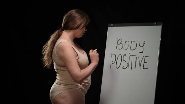 Confident Plus Size Caucasian Brunette Woman Standing at Whiteboard Writing Body Positive Smiling alt