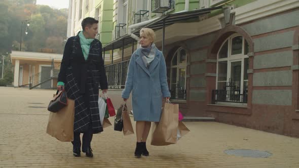 Middleaged Women Shopping Enjoying Pastime at Retirement Outdoors alt