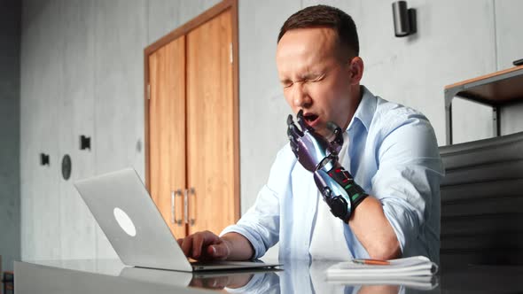 Disabled programmer with bio hand high tech prothesis solves problem typing on laptop alt